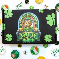 lack and green mailer with gold RUD logo and four-leaf clovers