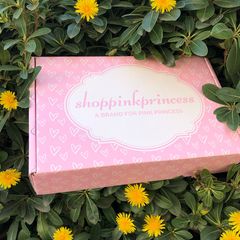 Pink mailer with elegant calligraphy &ndash; photographed in garden flowers