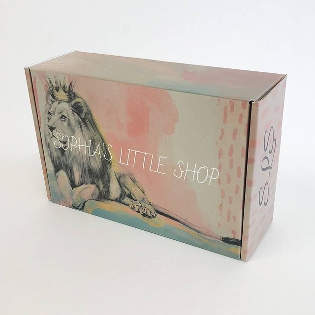 Pink and green wildlife-themed box with 'Little Shop' branding