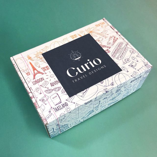 White marble mailer with 'Coutie' luxury fashion branding