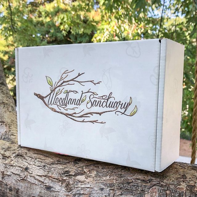 Silver box with script logo &ndash; rustic wood backdrop
