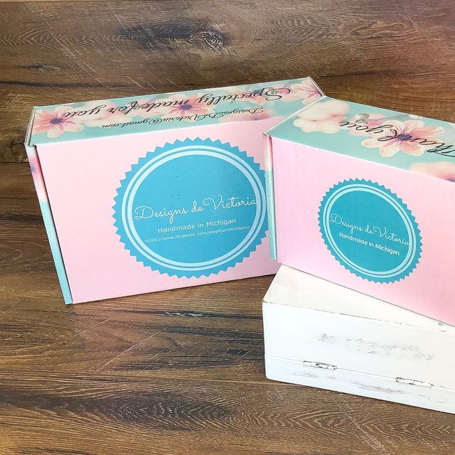 Light blue double mailers with round logo seals and insert card
