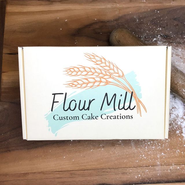 Rustic white and gold 'Flour Mill' mailer on wood table