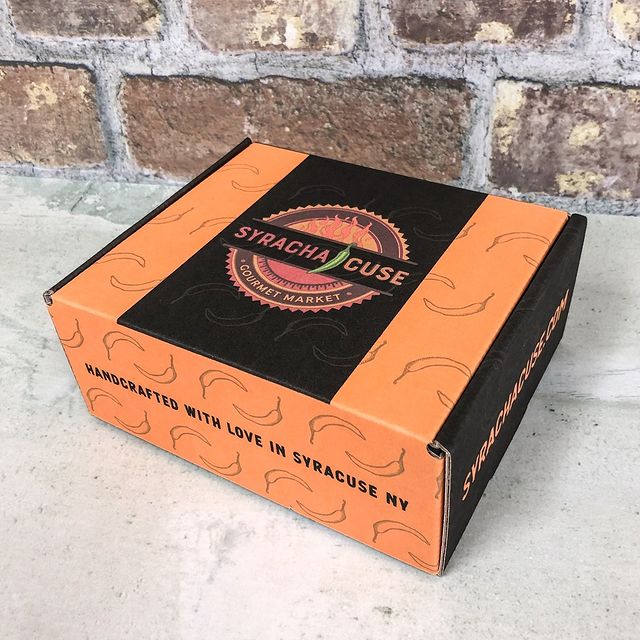 Orange and black eco mailer with leaf and fire logo